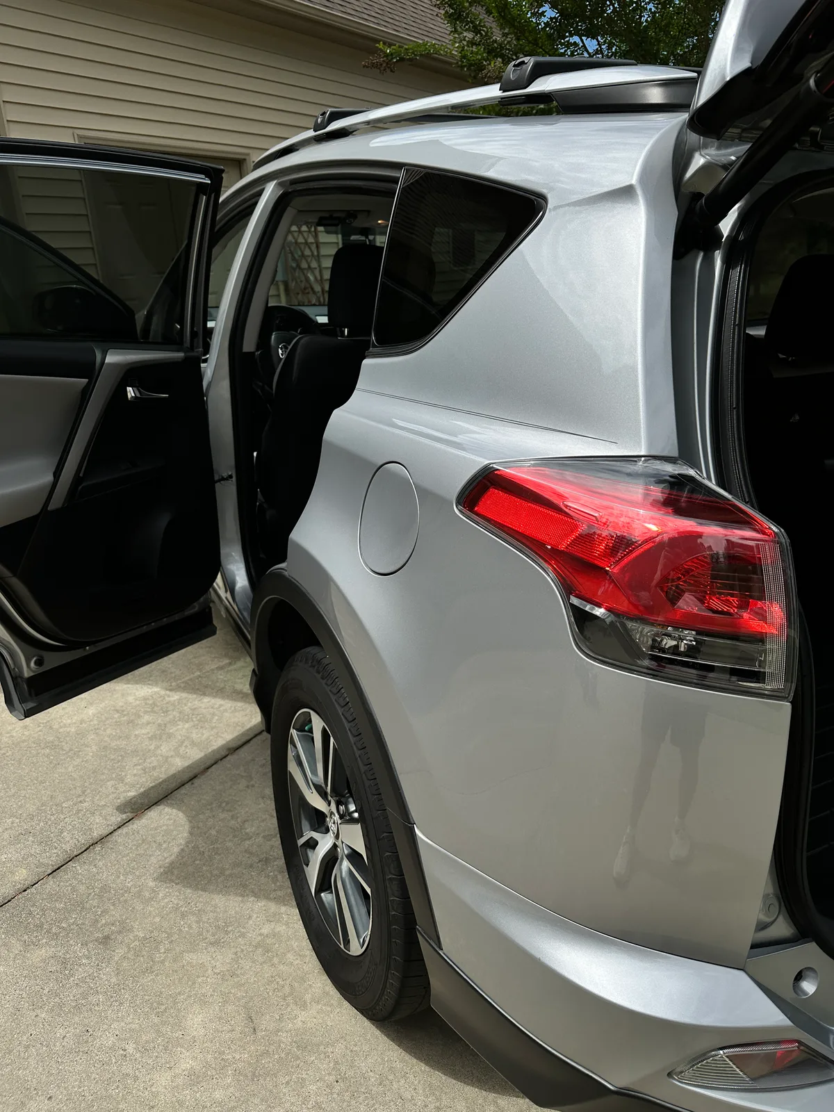 Silver SUV second row seats after detail — spotless gray fabric interior