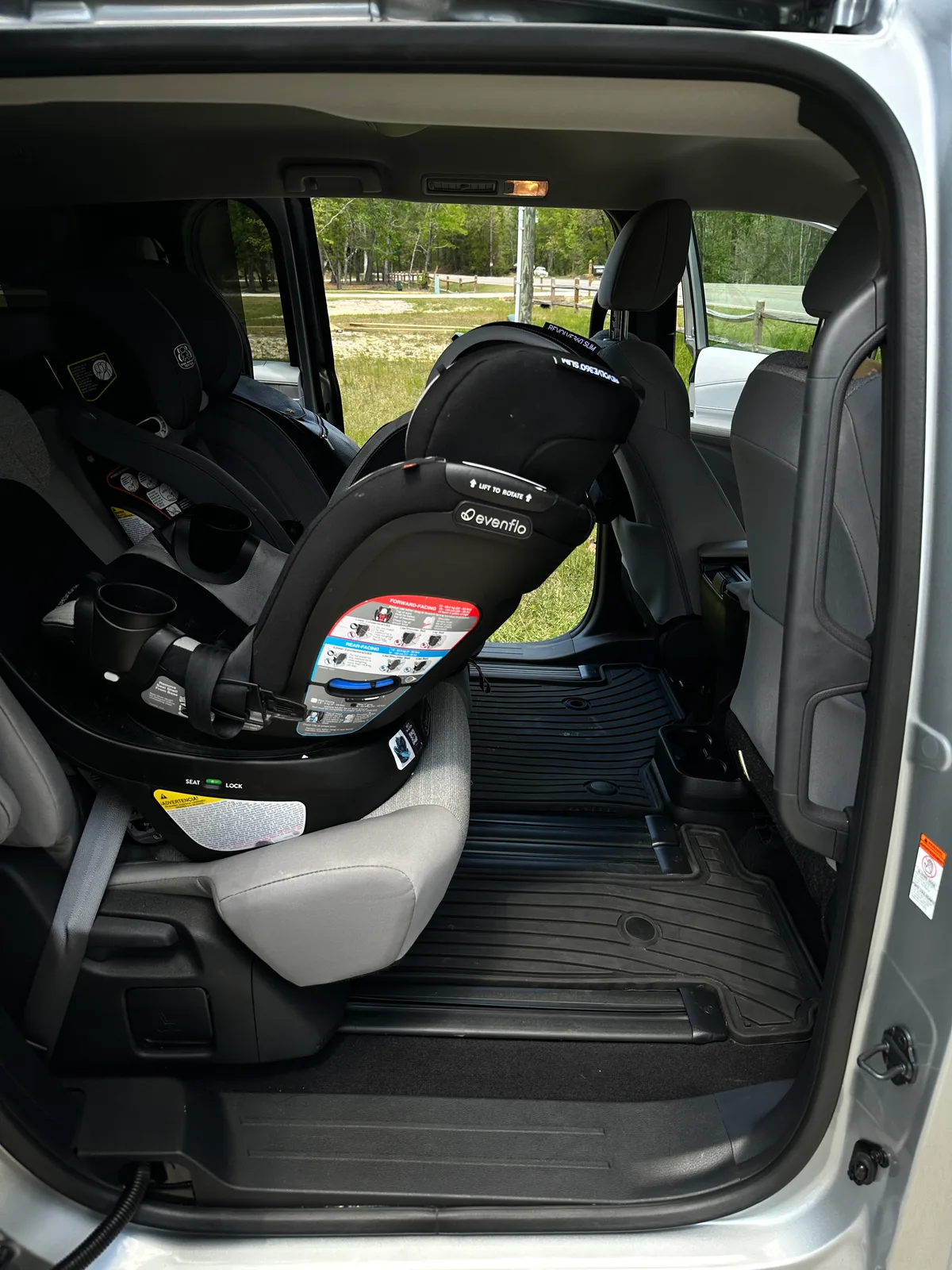 Family SUV interior after detail with car seat — deep cleaned cargo and second row