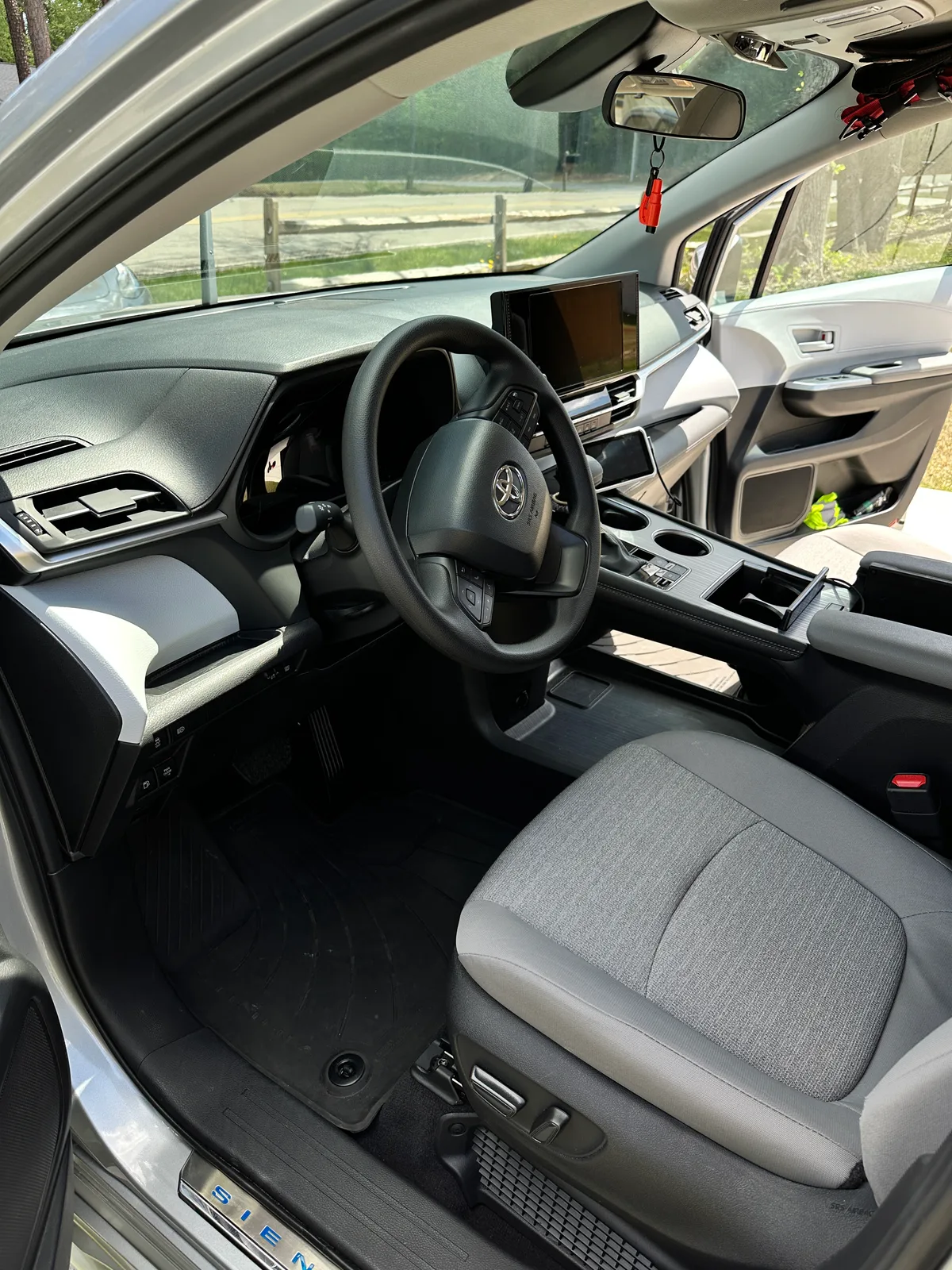 Family SUV door and seat area after interior detail — spotless fabric and panels