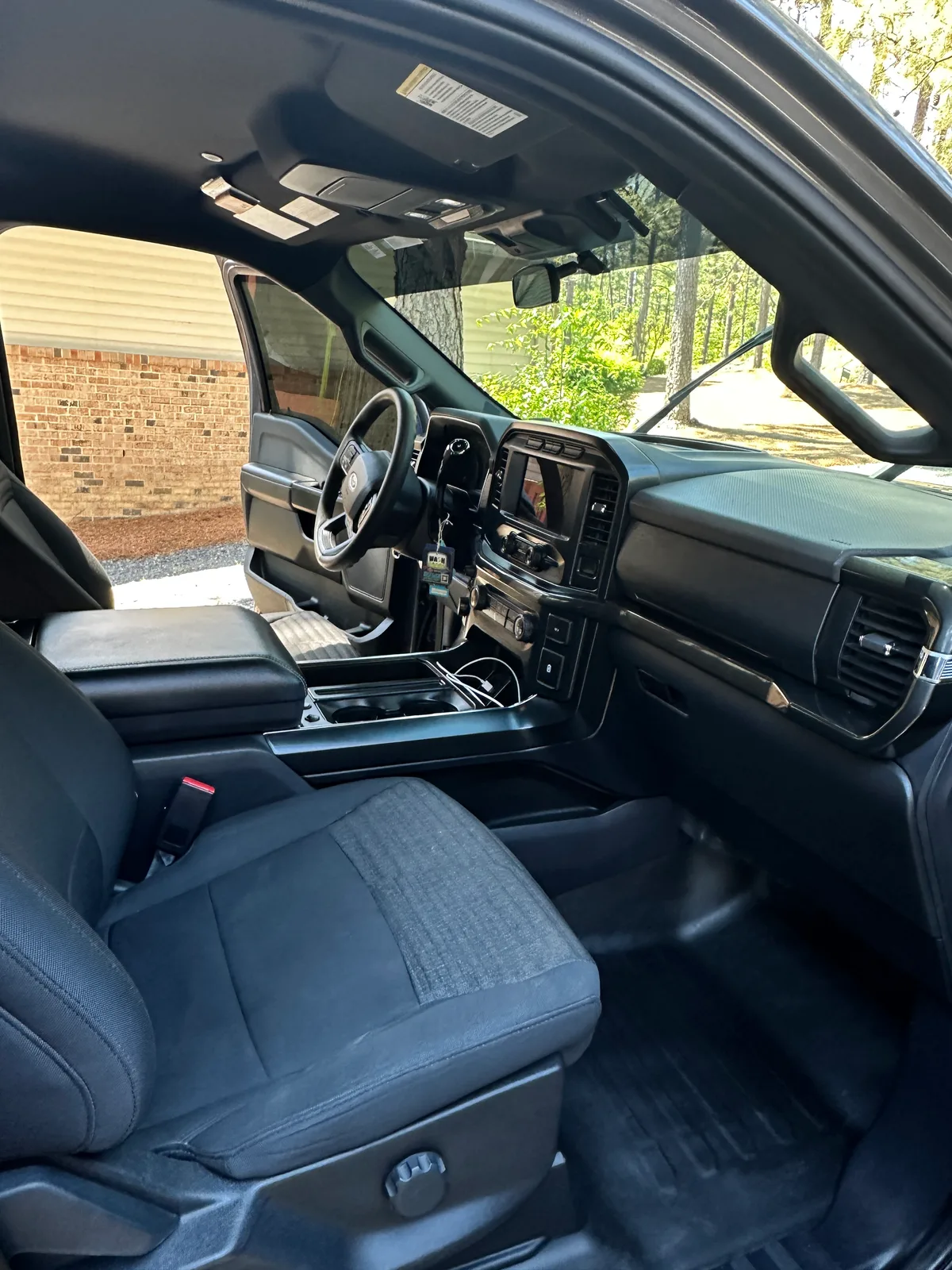 Dark SUV second row after Back Nine detail — clean dark gray fabric seats