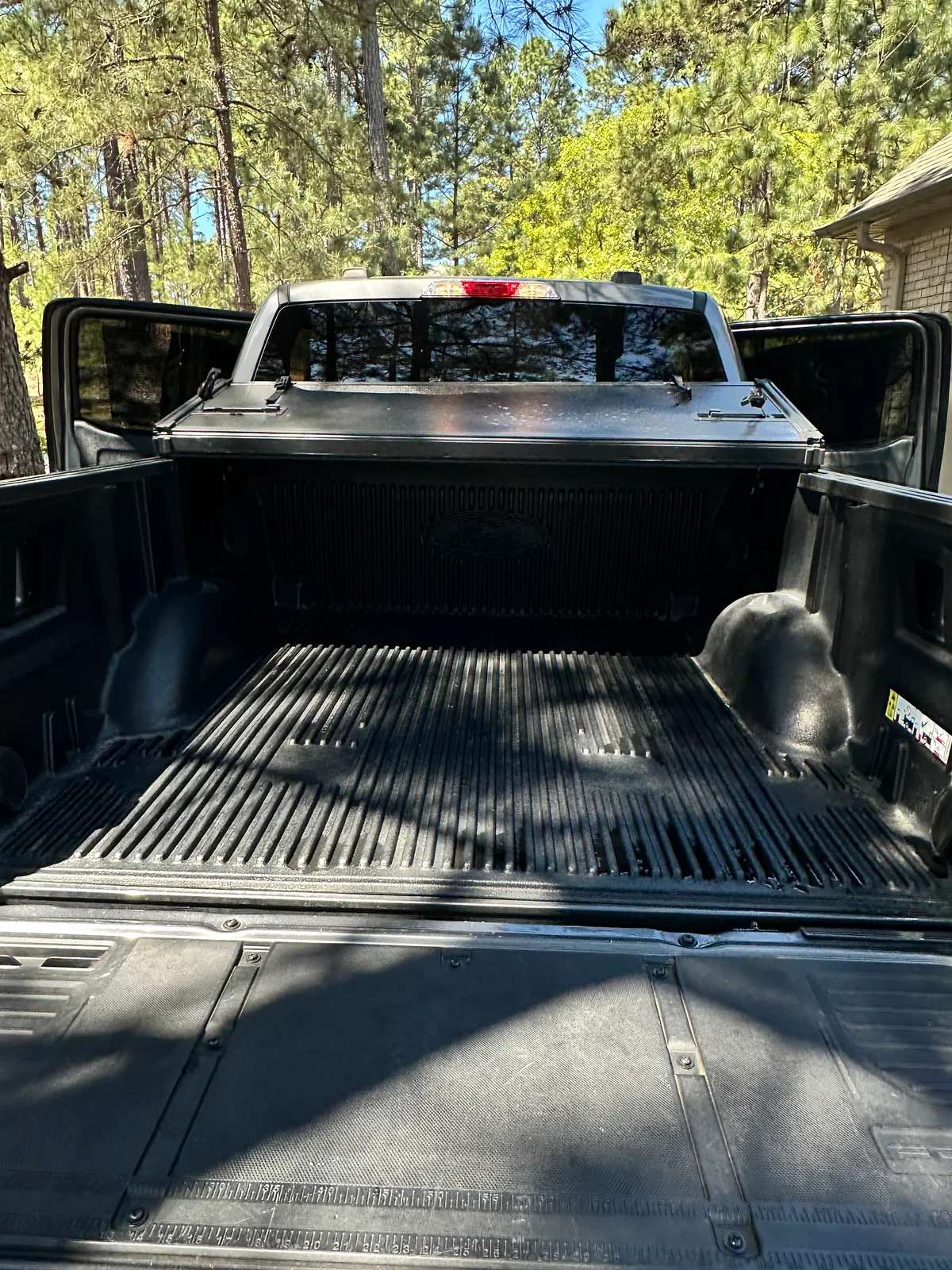 Dark SUV overhead view after detail — clean seats and headliner