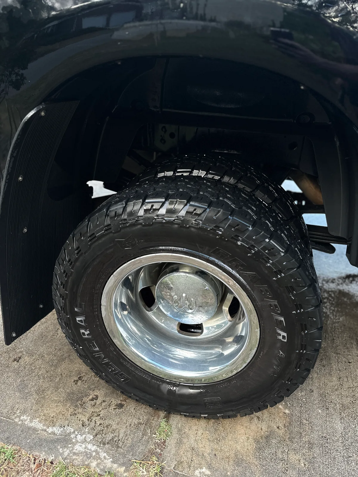Dually truck polished wheel after exterior detail — clean chrome rim and tire Pinehurst NC
