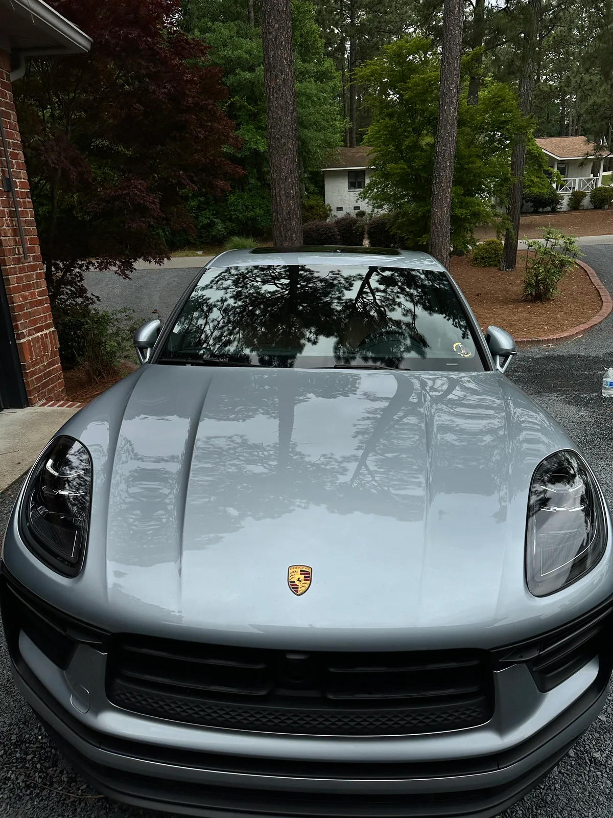 Silver Porsche front exterior after full detail — polished hood and headlights Pinehurst NC