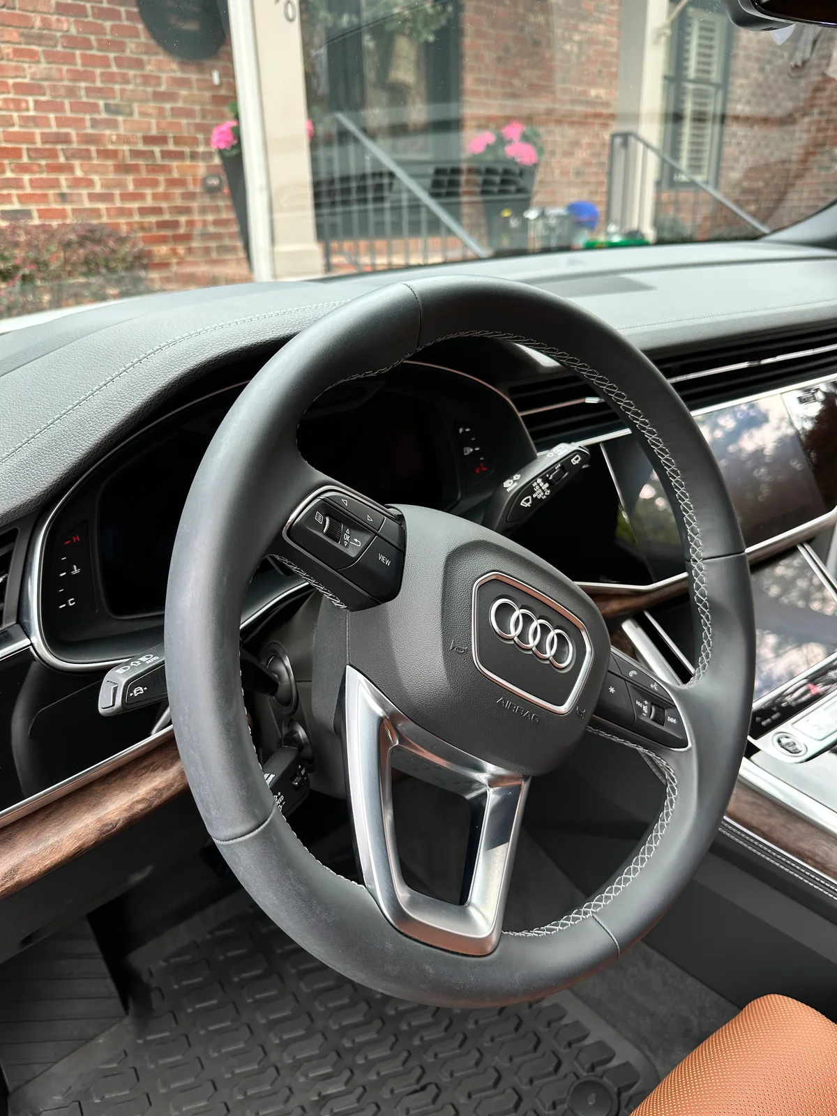 White luxury SUV rear hatch open after detail — clean cargo floor and seat backs