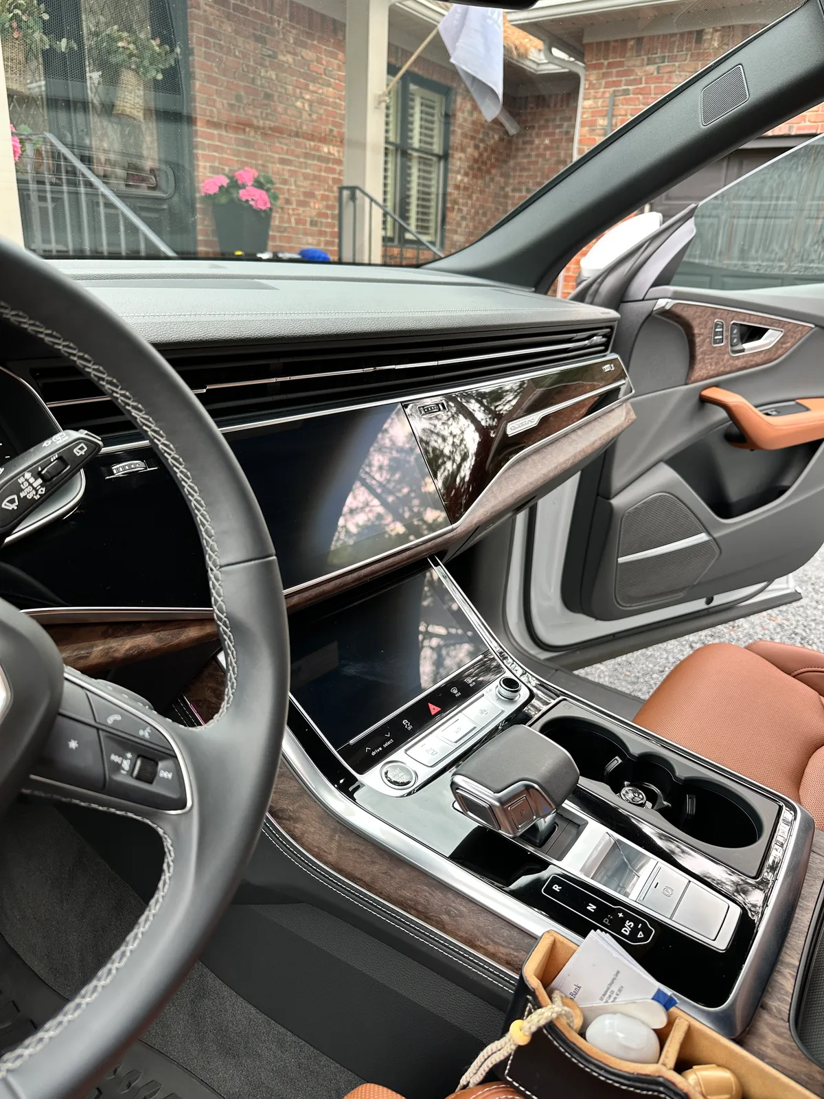 White luxury SUV second row after interior detail — deep cleaned tan leather bench