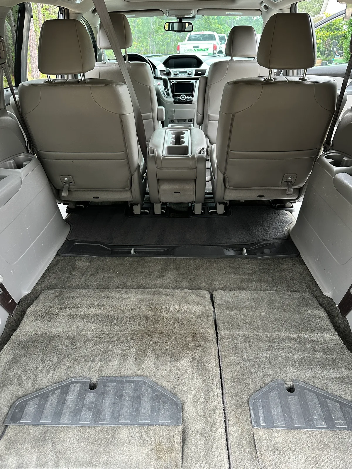 Honda interior after detail — spotless center console and cup holders
