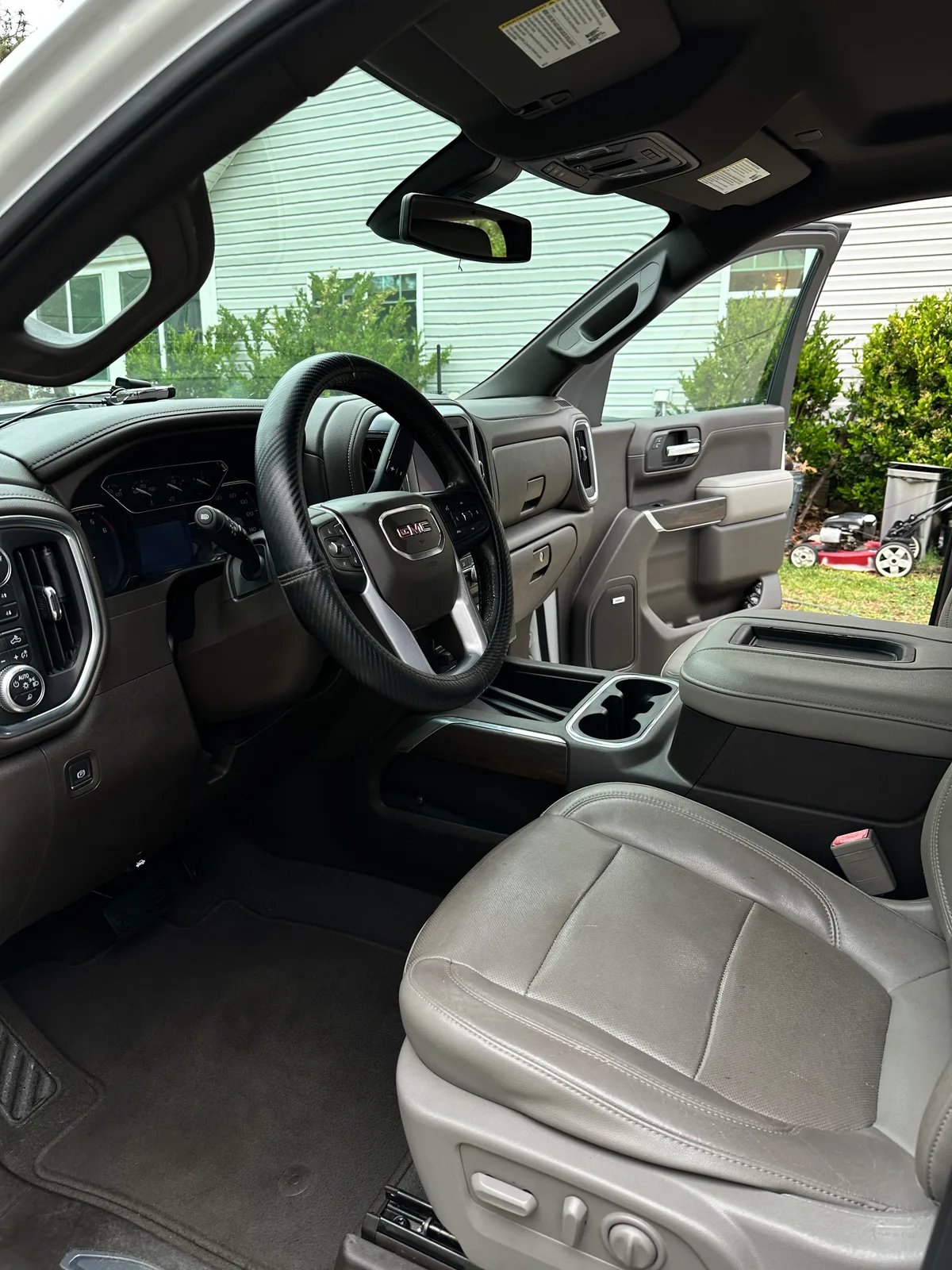 Honda interior after detail — clean front seats and floor mats