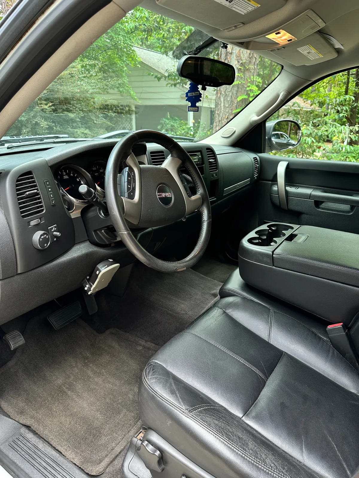 GMC truck interior after detail — clean black leather and steering wheel Pinehurst NC