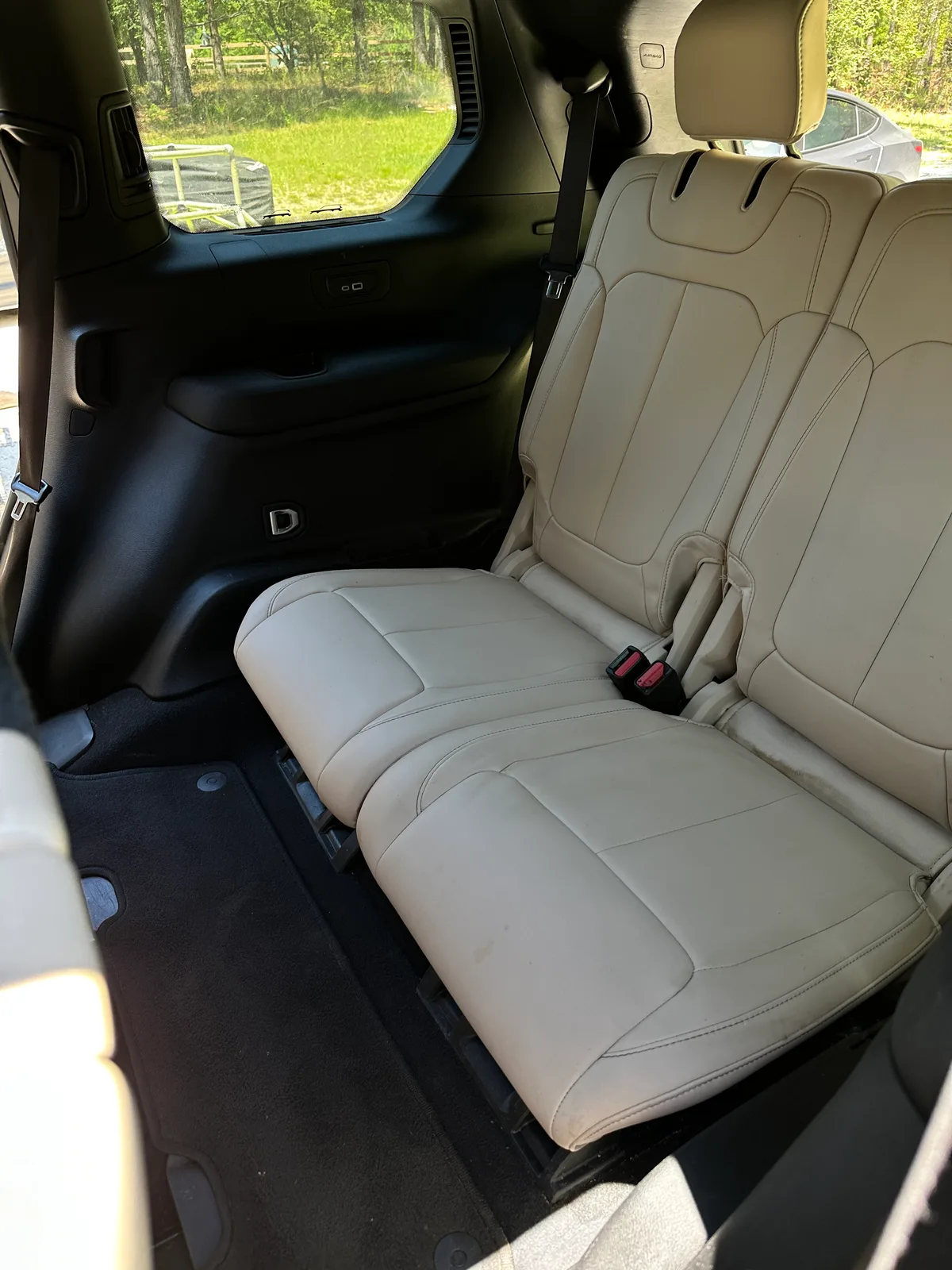 Luxury SUV third row after interior detail — spotless cream leather seats Pinehurst NC