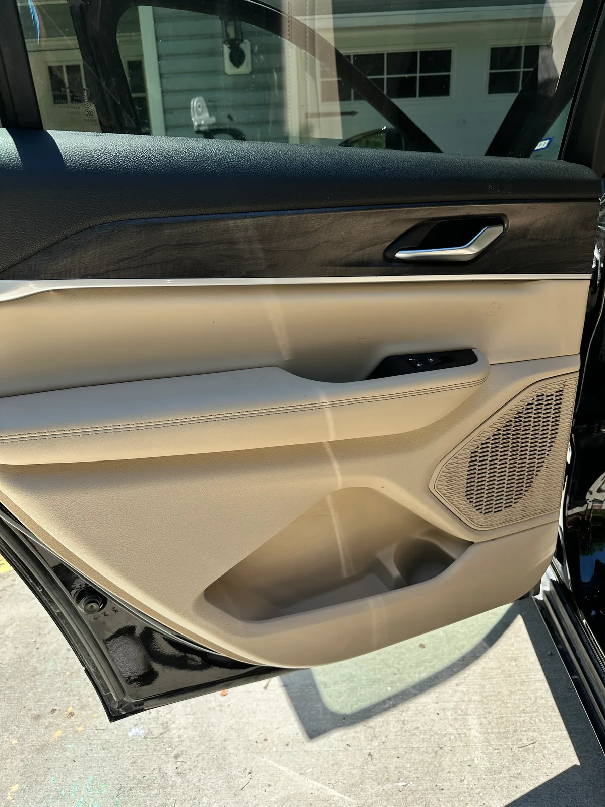 Luxury SUV rear seat after interior detail — deep cleaned cream leather