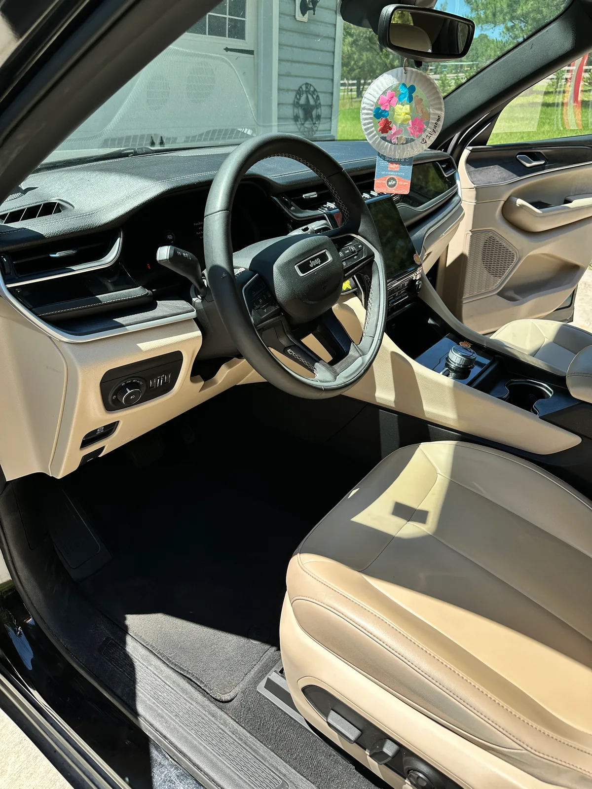 Luxury SUV cargo area after detail — clean floor liner and seat backs