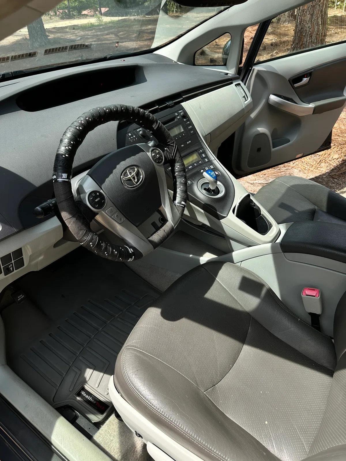 Toyota interior after detail — clean gray fabric seats and steering wheel Pinehurst NC
