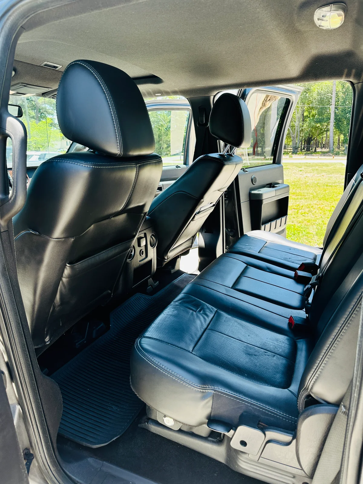Truck interior after detail — spotless black leather seats